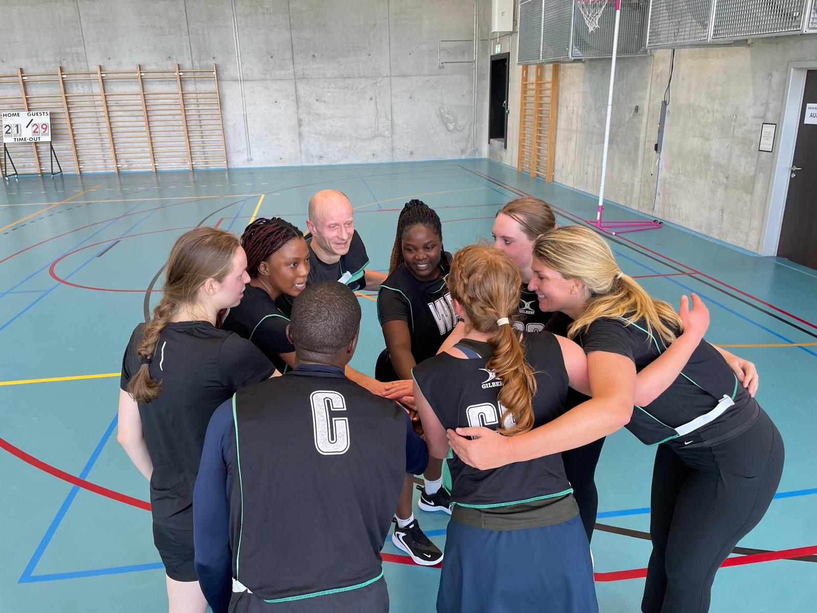 Antwerp Netball Club players during a team huddle